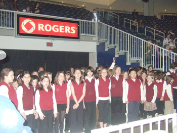 Dewson students sing O Canada at Ricoh Coliseum , Hockey Game . 010